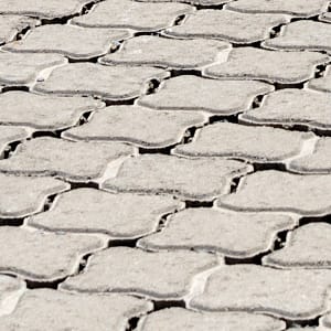 Permeable and open grid concrete blocks for pavements and roads